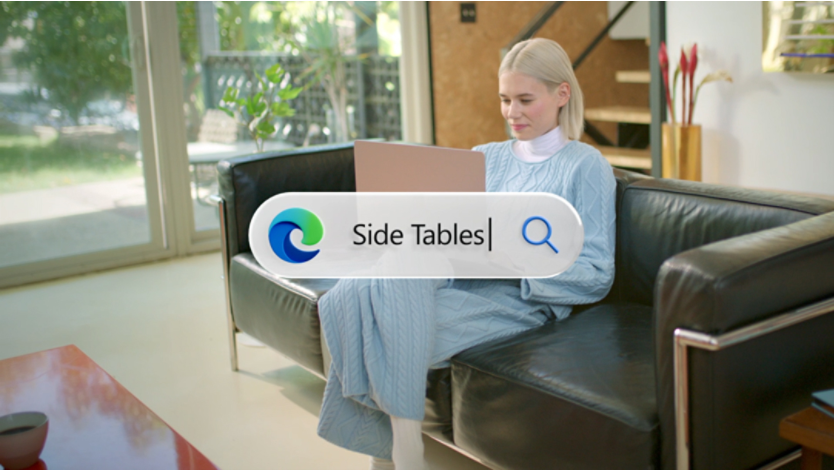 Woman sitting on a couch working on her laptop