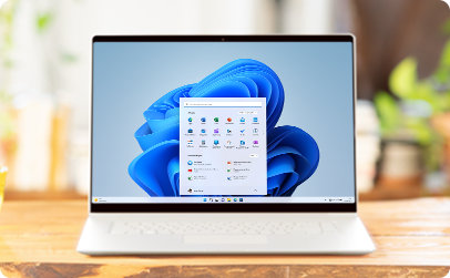 Um portátil com o Windows 11 a apresentar uma imagem a florescer e aplicações afixadas no ecrã